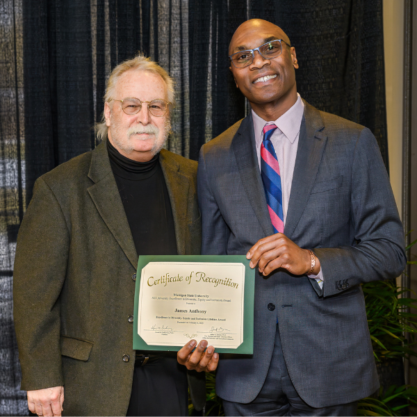 James Anthony, PhD, MSc, professor in the Department of Epidemiology and Biostatistics, receiving the Lifetime Achievement Award. Posed with Jabbar Bennett, MSU's vice president and chief diversity officer.